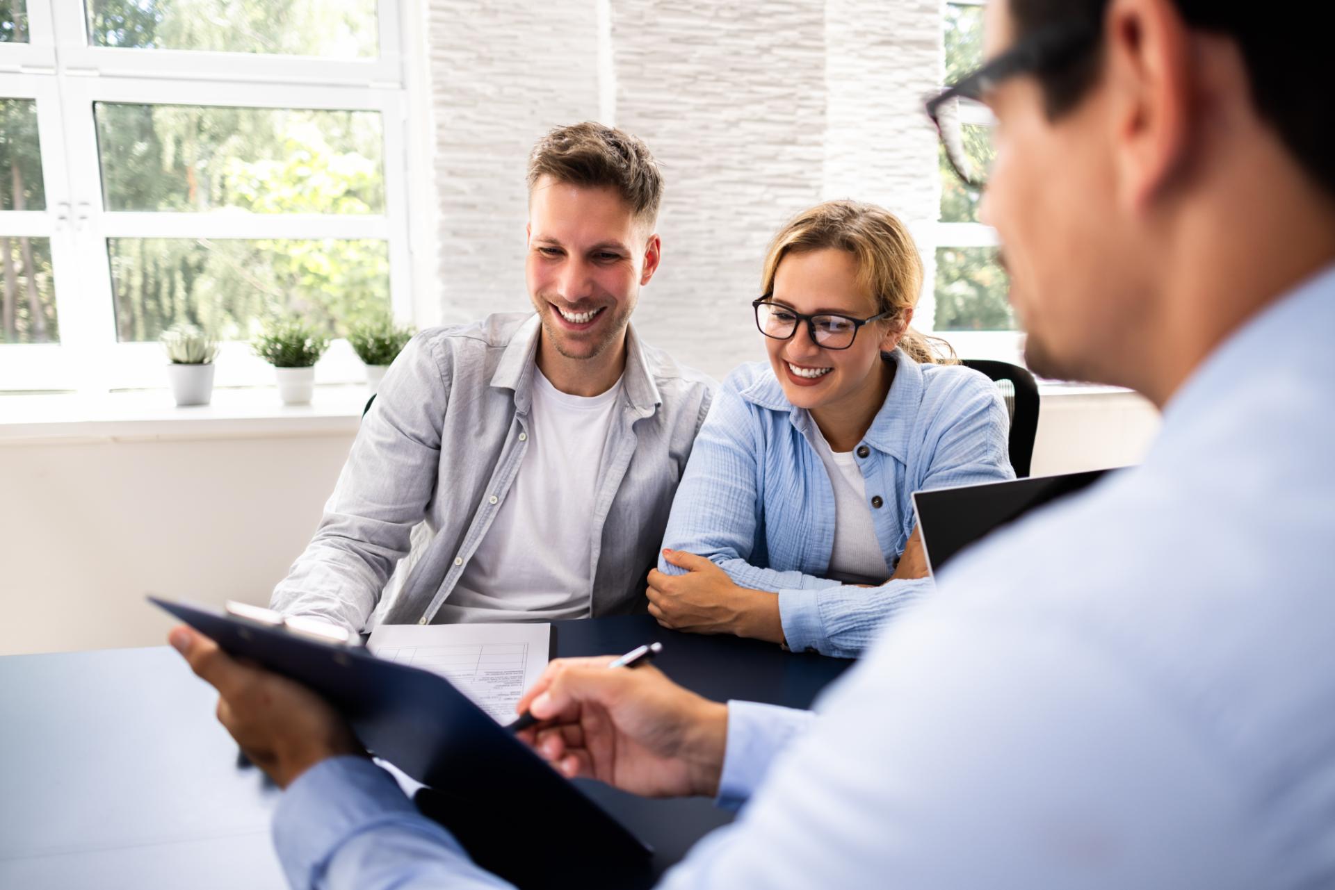 Couple discussing with advisor